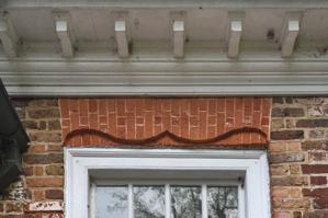 Double-ogee gauged-and-rubbed arch over door